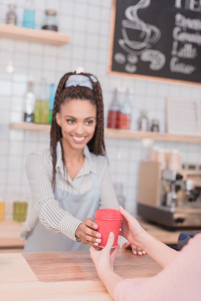 barista handing customer coffee - Фото, изображение