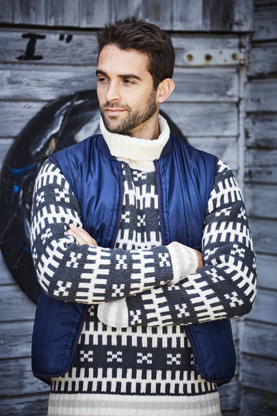 Handsome guy in sweater and body warmer  - 写真・画像