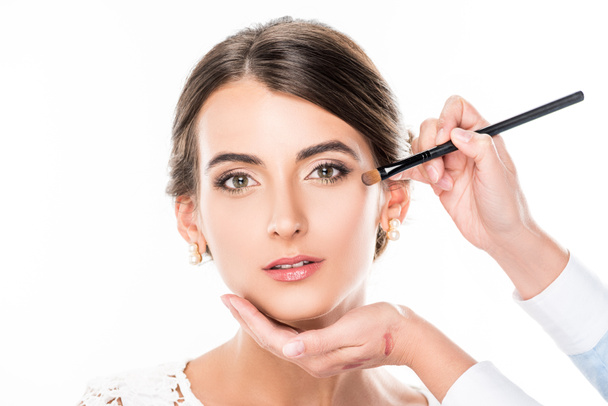 makeup artist applying concealer - Fotó, kép