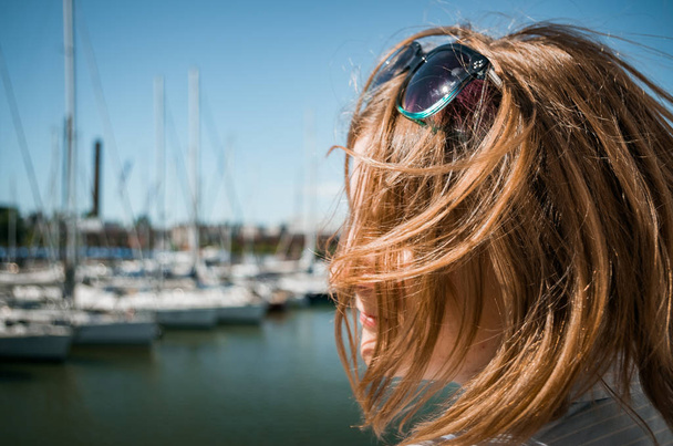 woman with hair fluttering by wind - Photo, Image