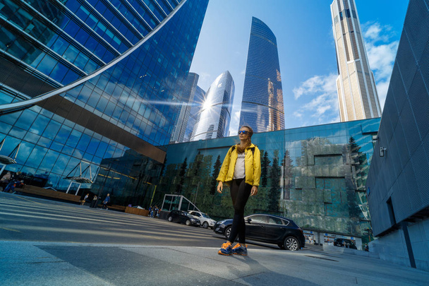 traveler woman looking at building in moscow city - Fotó, kép
