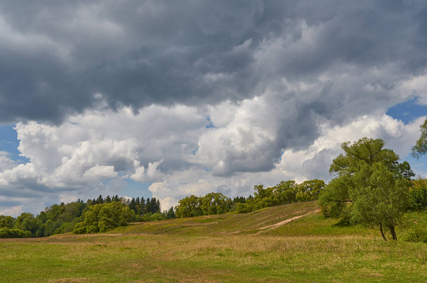 Landscape with thunder clouds sky - Zdjęcie, obraz