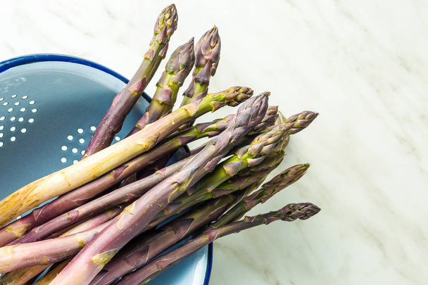 Fresh purple asparagus. - Fotó, kép