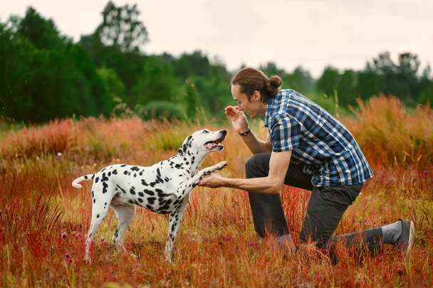 Owner with dog on field - Fotografie, Obrázek