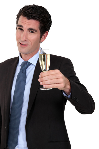 High-spirited businessman drinking a toast - Fotografie, Obrázek