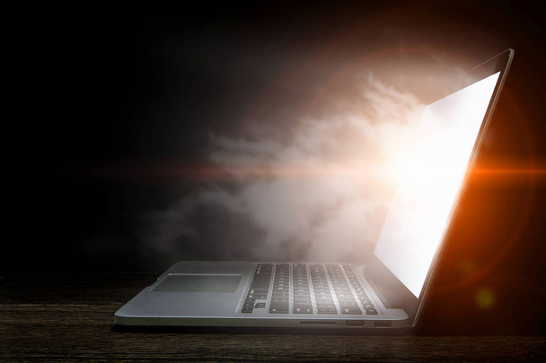 Glowing laptop device. Mixed media - Photo, image