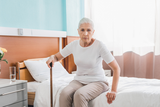 senior woman with cane in hospital - Foto, Imagen