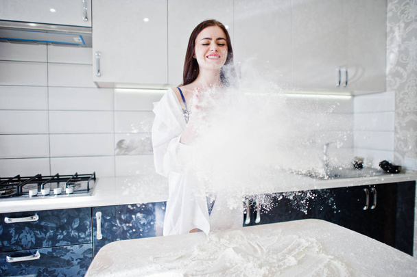 Brunette girl, wear at shirt and underwear play with flour at th - Foto, Bild