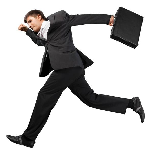 Running businessman with briefcase isolated on white background - Foto, imagen