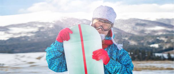 Portraite of sport woman in snowy mountains - Photo, Image
