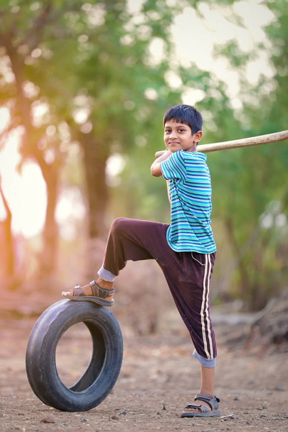 Rural Indian Child Playing Cricket - Photo, Image