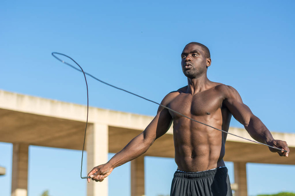 African American man training  jumping rope - Foto, immagini