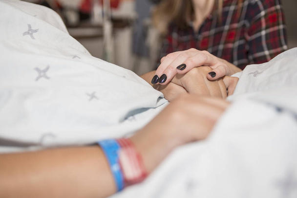 Sick patient lying on bed in hospital for medical background - Fotografie, Obrázek