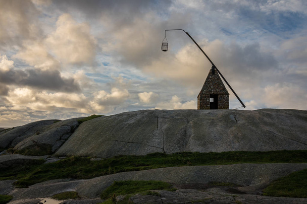 Old lighthouse made of rocks, at Verdens Ende in Vestfold Norway - Foto, imagen