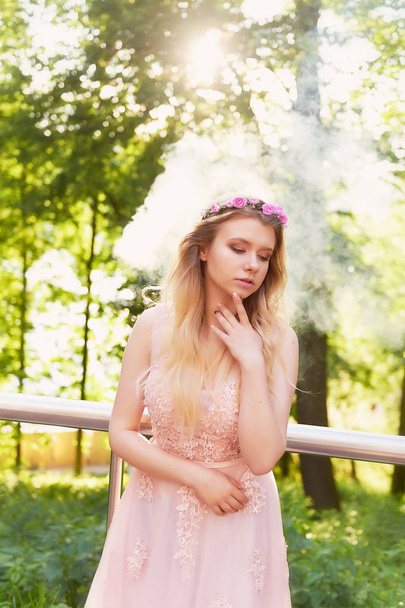 Silhouette swirling in the setting sun in the beautiful woods of the bride in the peach dress with lace.Blonde with a good figure.The feeling of happiness and serenity - Fotó, kép