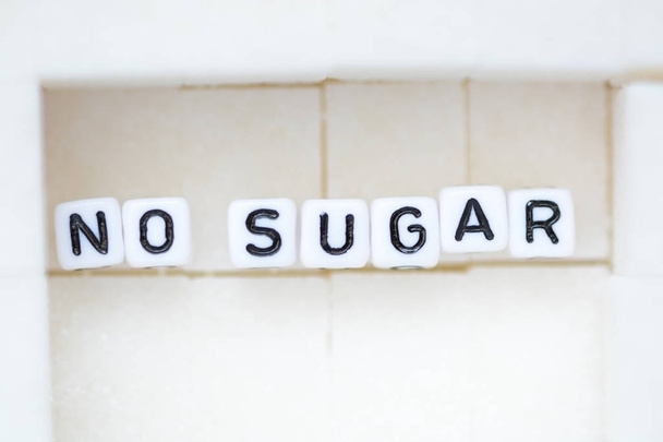 No sugar recommendation, text from letter beads on sugar cubes - Φωτογραφία, εικόνα