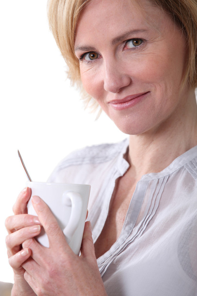 Woman holding a cup of tea. - Fotografie, Obrázek