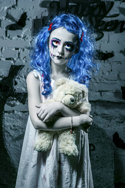 Little blue hair girl in bloody dress with scary halloween makeup - Фото, изображение
