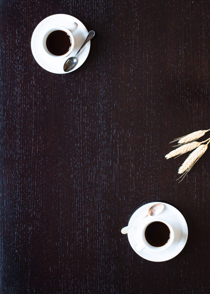 Coffee beans and cup of coffee with other components on differen - Foto, imagen