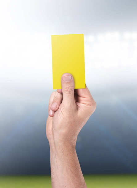 Yellow Card On Stadium Background - Foto, afbeelding