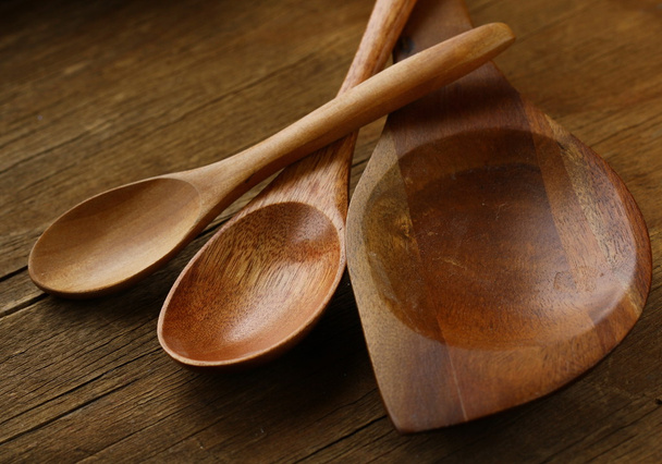 Empty wooden spoons on a wooden background - Photo, image