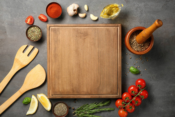 Composition with wooden board and ingredients for cooking on table - Valokuva, kuva