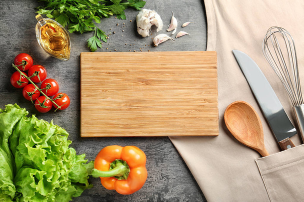 Wooden board and vegetables  - Фото, зображення