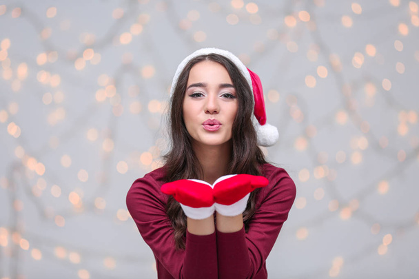 Beautiful woman in Christmas hat  - Photo, Image