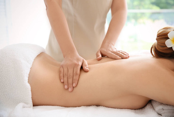 Young beautiful woman having massage in spa salon - Φωτογραφία, εικόνα