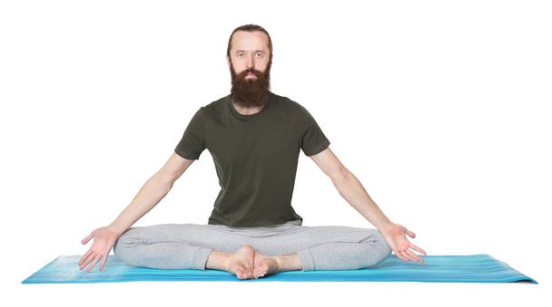 Young man practicing yoga - Фото, изображение