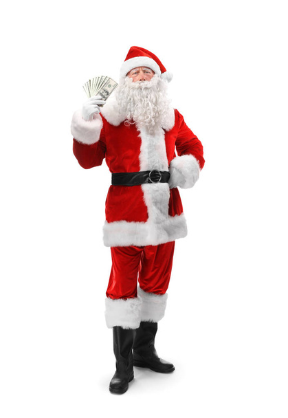 Santa Claus holding money on white background - Φωτογραφία, εικόνα