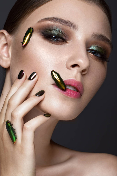 Portrait of beautiful girl with colorful make-up and cockroaches. Beauty face. - Fotoğraf, Görsel