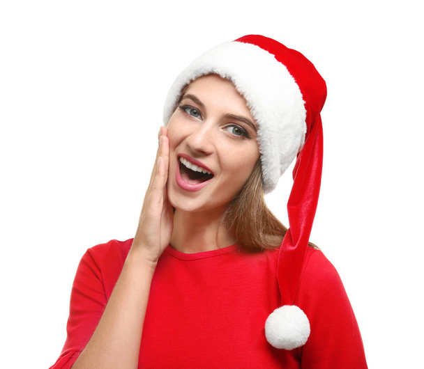 Beautiful young woman in Santa hat on white background - Foto, Imagem