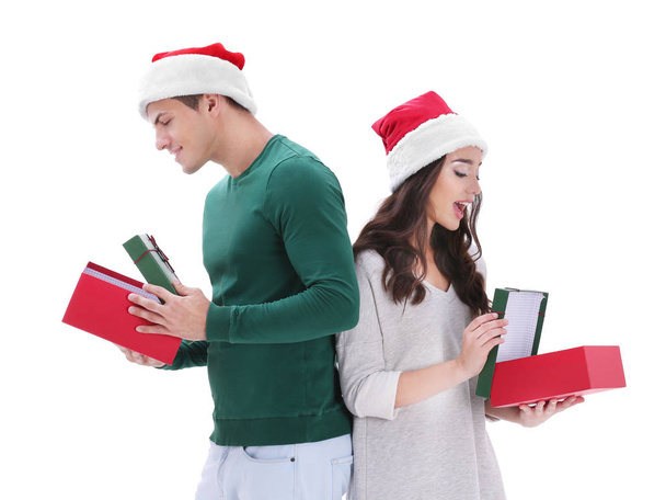 Happy young couple in Christmas hats  - Foto, imagen