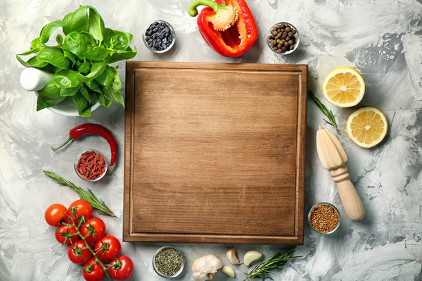 Composition with wooden board and ingredients for cooking on table - Fotoğraf, Görsel