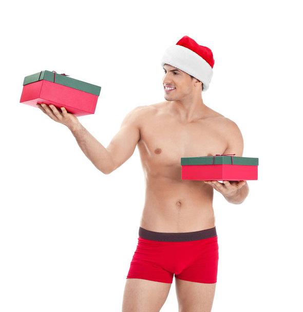Muscle man in Christmas hat  - Zdjęcie, obraz