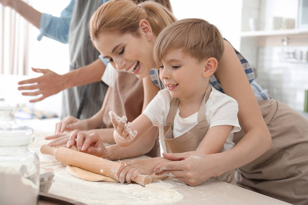 Family cooking in kitchen. Cooking classes concept - Photo, image