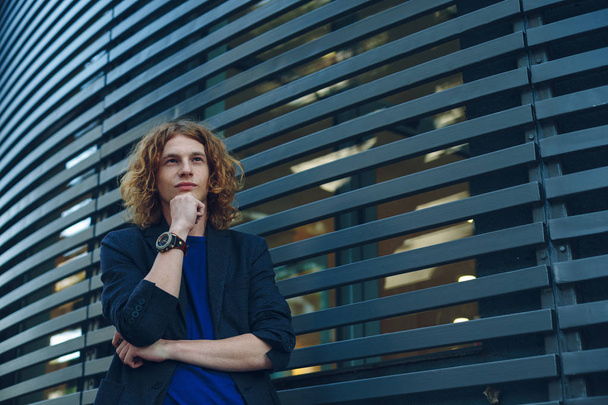 Portrait of red haired man over urban futuristic background - Fotoğraf, Görsel