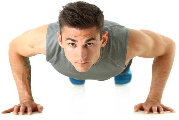 Fitness uomo strizzando dal pavimento isolato su bianco
 - Foto, immagini