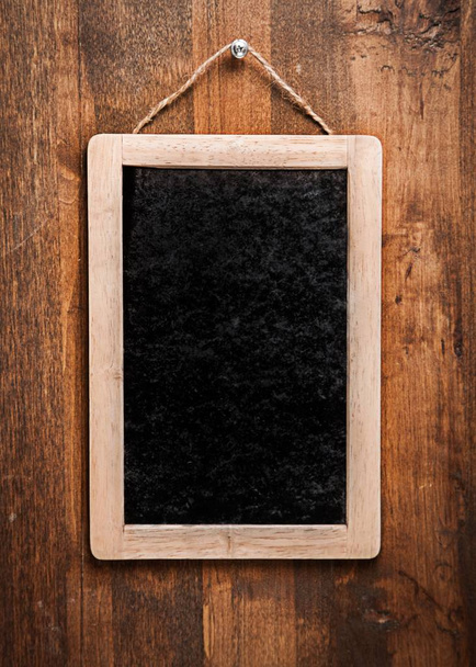 little board with wooden  frame on background - Φωτογραφία, εικόνα