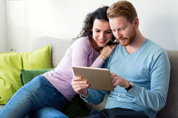 Young couple using digital tablet  - Fotó, kép