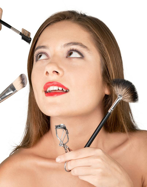 makeup artist doing makeup for girl  - 写真・画像