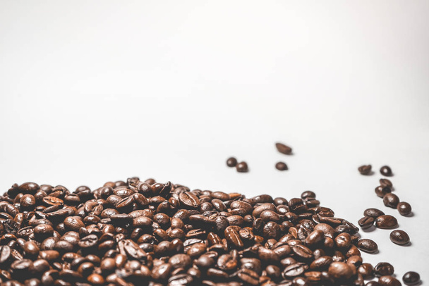 fried coffee grains on white background close-up - Фото, зображення