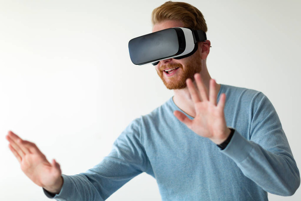 Man wearing virtual reality headset  - Fotoğraf, Görsel