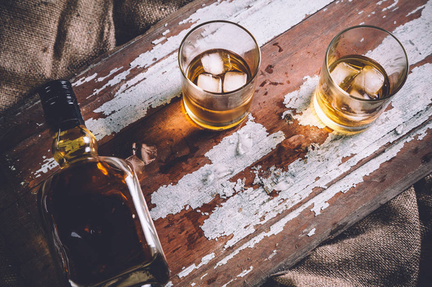 whiskey with ice, a bottle of rum tequila... - Fotoğraf, Görsel