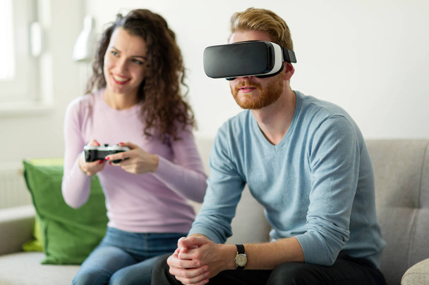 Happy  couple playing video games  - Φωτογραφία, εικόνα