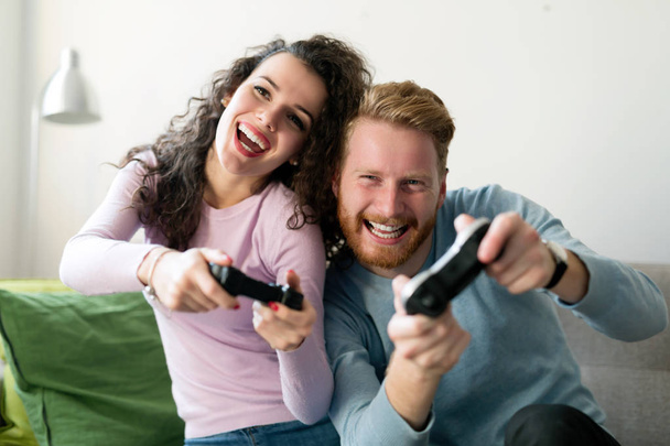 Happy  couple playing video games  - Фото, зображення