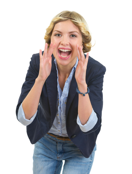 Smiling teenage girl shouting through megaphone shaped hands - Φωτογραφία, εικόνα