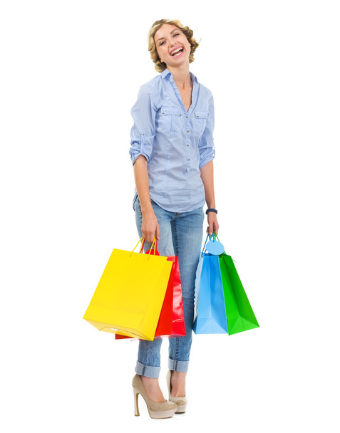Portrait of smiling teenage girl with shopping bags - Foto, imagen