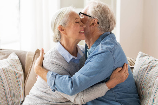 happy senior couple hugging at home - Foto, Imagen